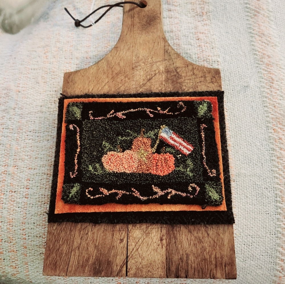 Cutting board with super cute needle punch design attached.